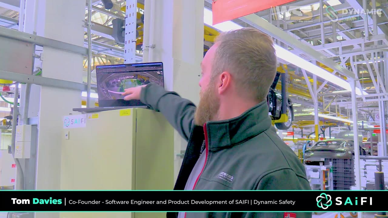 Tom Davies on the deployment site, showing the SAiFI Edge Essential system running on a laptop at a luxury automotive manufacturing facility in Crewe
