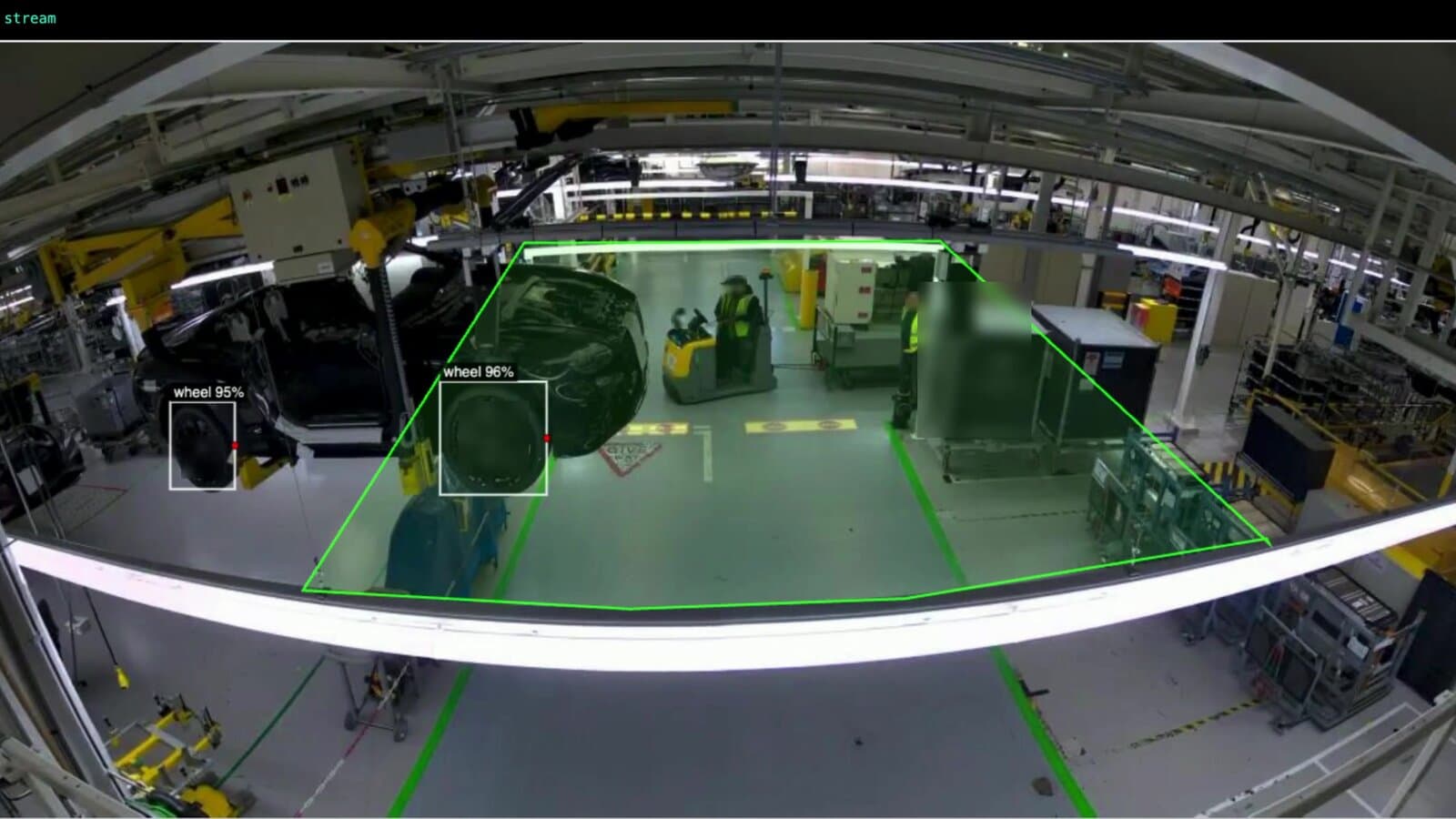 SAiFI live inference dashboard showing a green spatial zone polygon overlaid on a manufacturing floor with wheel detection bounding boxes, illustrating how zones, rules and detections combine